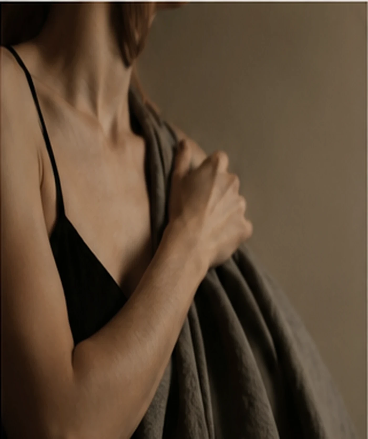 A quiet morning moment in soft charcoal textiles